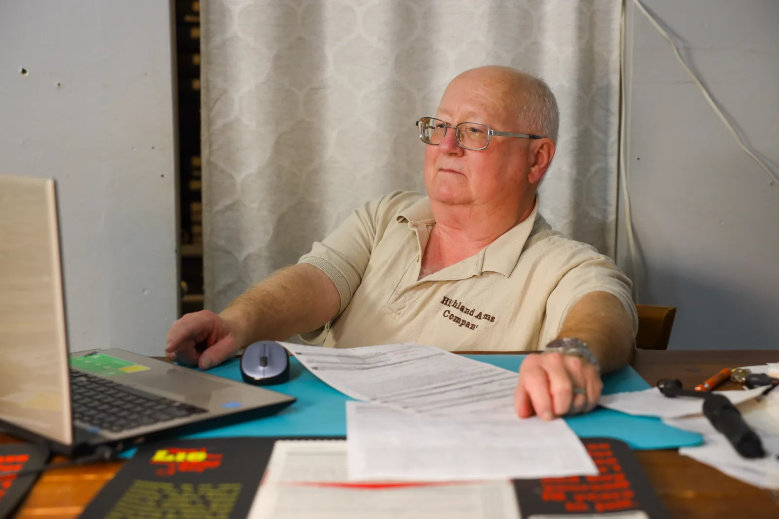 Jeffrey W. Graham at his desk handling paperwork